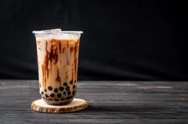 Brown Sugar Milk tea on a table with black background