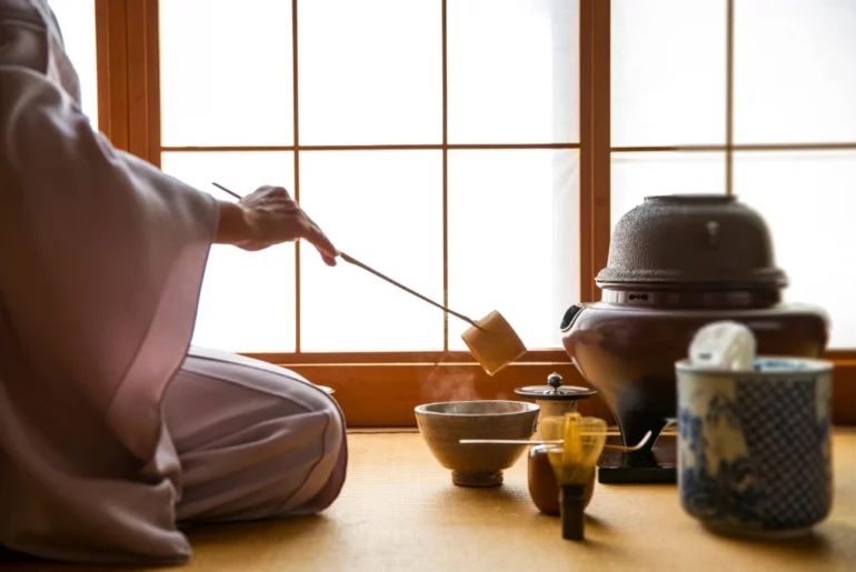 Woman preparing tea at the ceremony