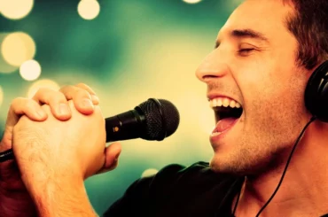 male singer with a microphone in his hands