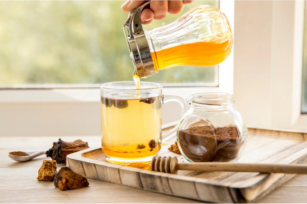 pouring tea into a glass
