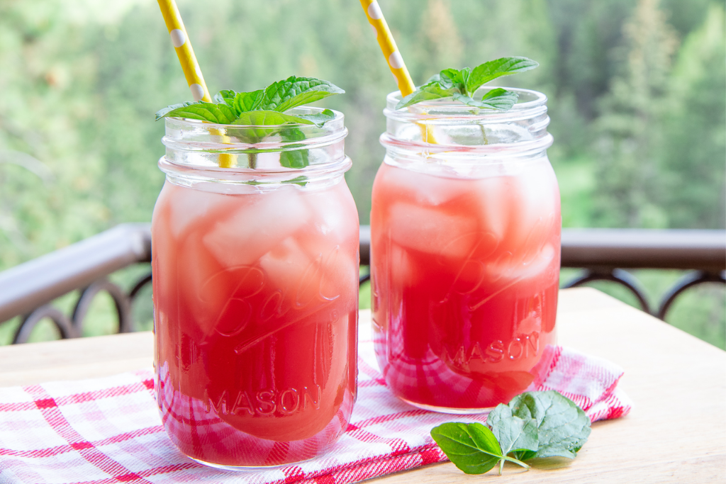 two glass of cold watermelon tea with mint and watermelon chunk