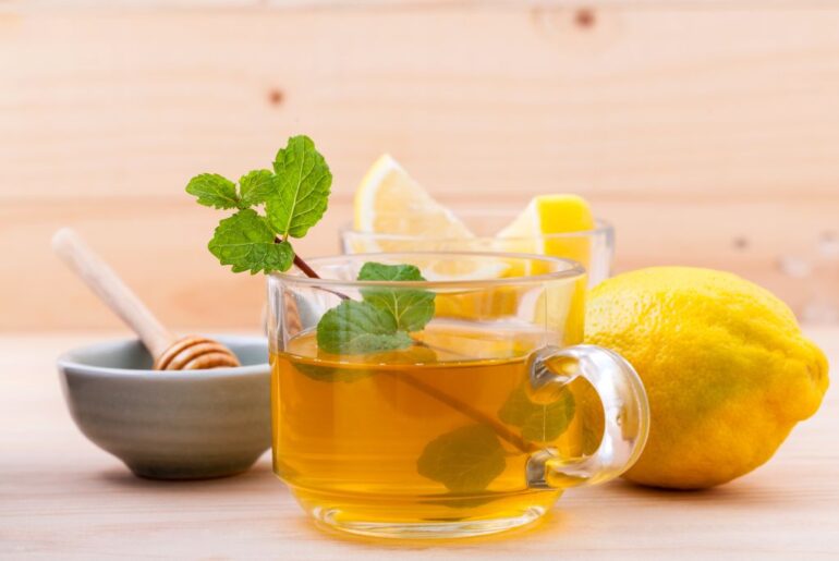 honey citrus mint tea with its ingredients on the background