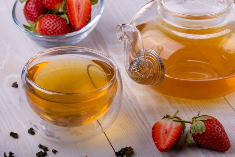 strawberry oolong tea cup on white table