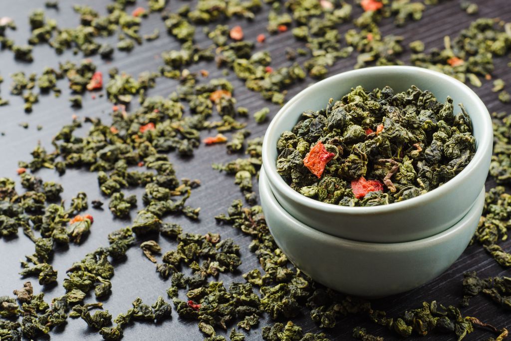 strawberry oolong tea herbs on white cup