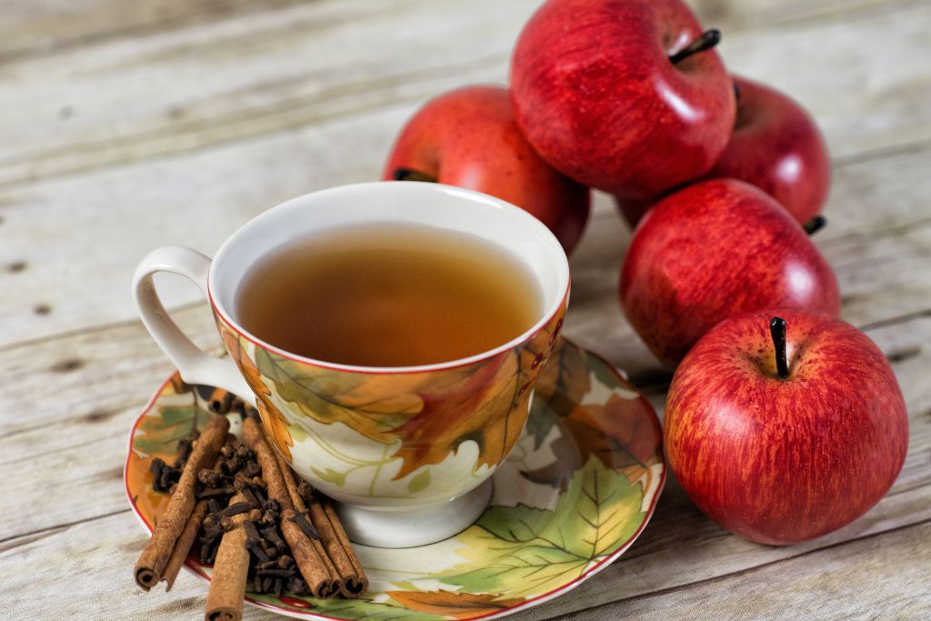 a cup of black tea infused with apple and cinnamon