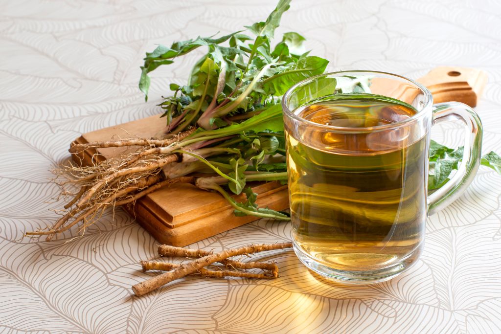 dandelion herbal tea on a mug, dandelion leaves and roots on cutting board