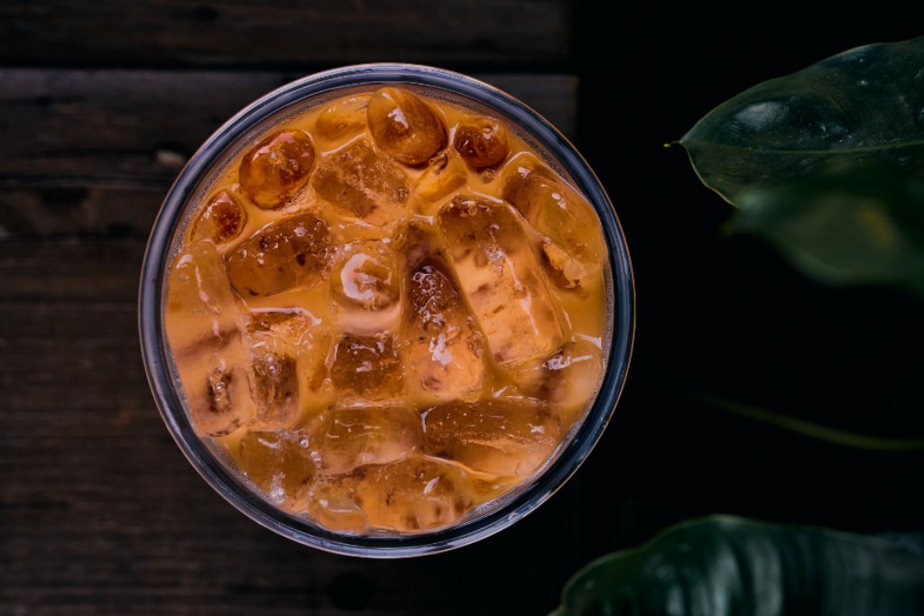 top view of thai iced tea on wooden table